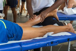 Athlete's Calf Muscle Professional Massage Treatment after Sport Workout: Fitness and Wellness